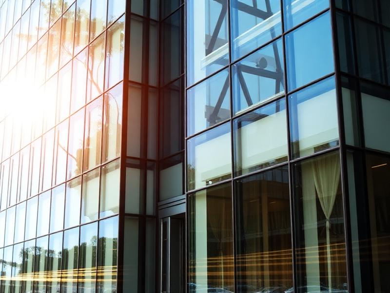 Glass office building exterior with commercial window tinting